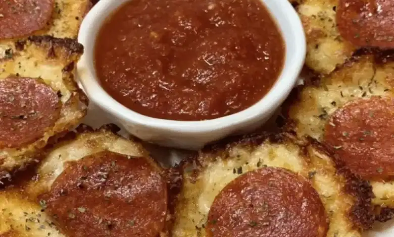 Delicious pepperoni pizza bites with melted cheese and marinara dip. Perfect appetizer for parties and gatherings.