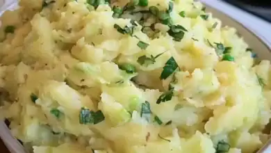 Creamy Mashed Potatoes with Fresh Herbs and Green Onions.